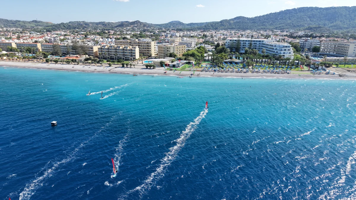Windsurfers on the turquoise water off Procenter in Trianda, photographed from above