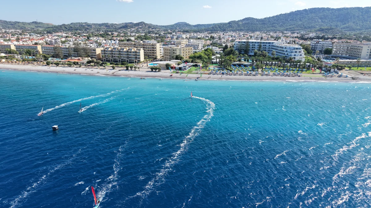 Windsurfers on the turquoise water off Procenter in Trianda, photographed from above