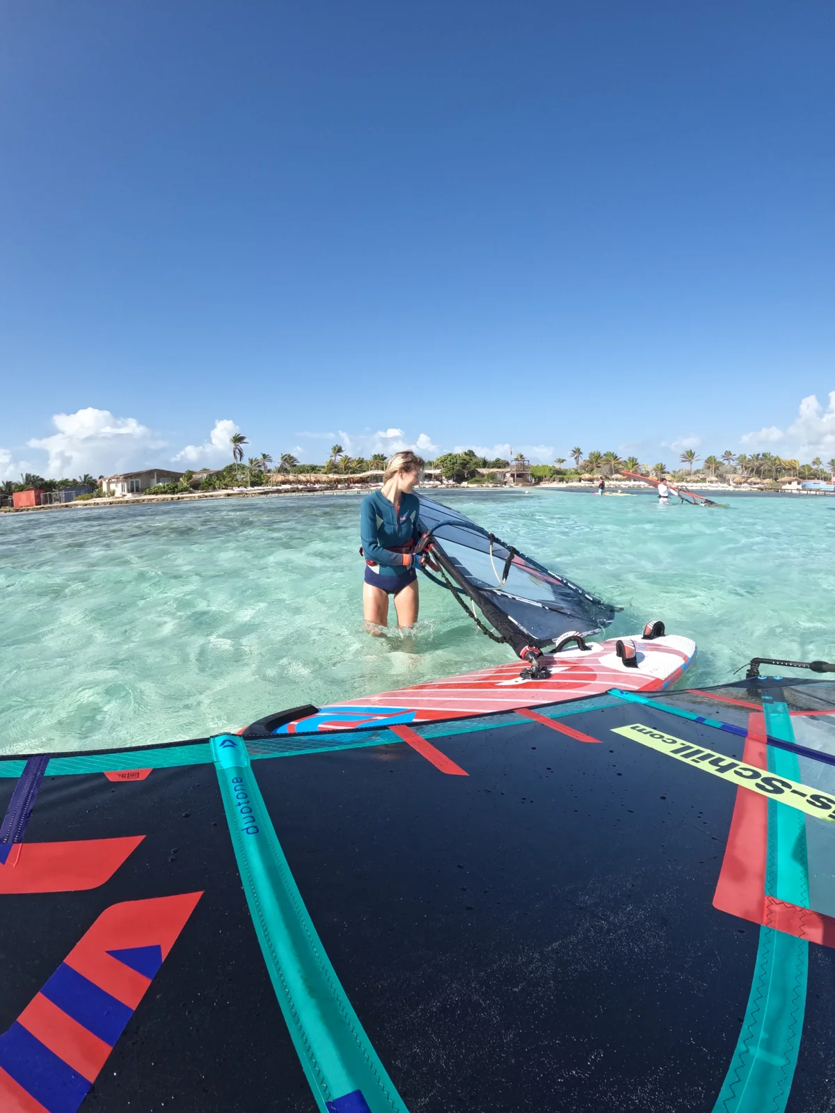 Windsurf boards and riders sharing a session