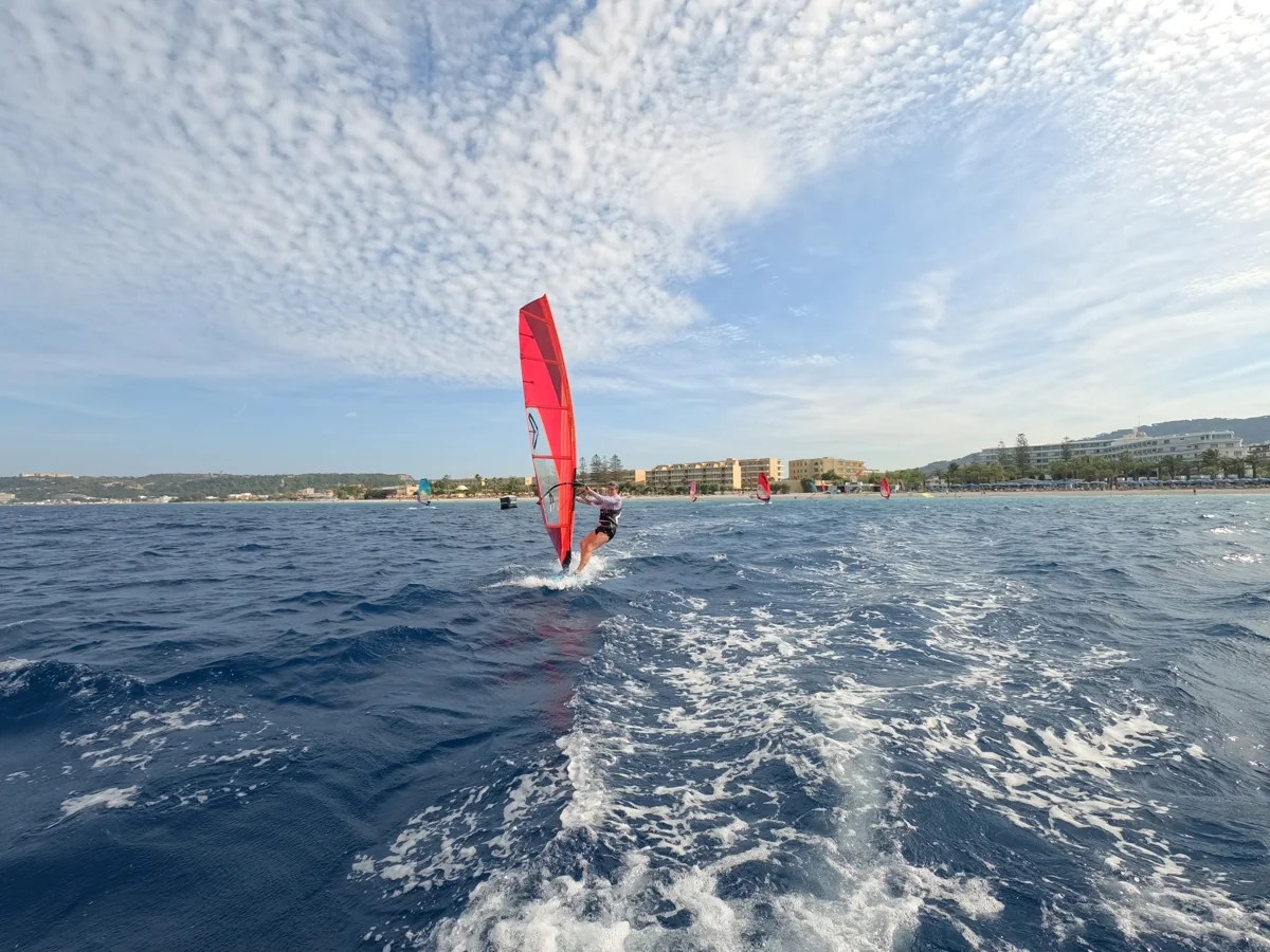 Freeride windsurfer followed on the water