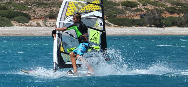Young rider windsurfing in the bay of Karpathos
